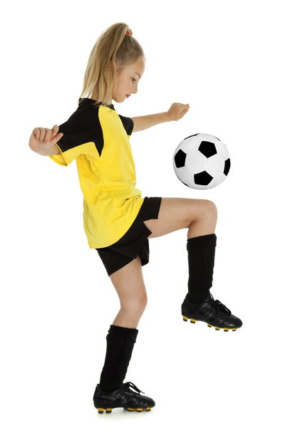 Досить маленька футбольна дівчинка
 - Фото, зображення