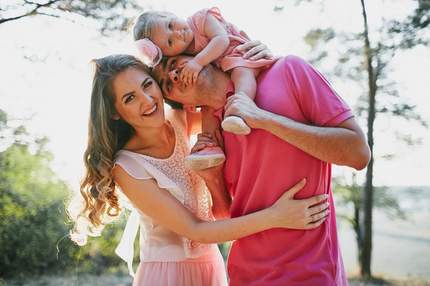 beautiful family of three people, mom dad and daughter - Photo, Image