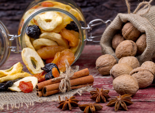 Dried fruits and nuts on a table - Foto, afbeelding