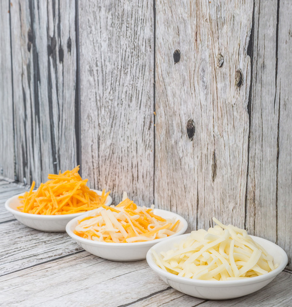 Mozzarella ralado e queijo Cheddar
 - Foto, Imagem