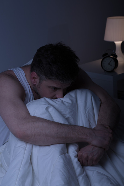 Depressed man alone in bed - Photo, image