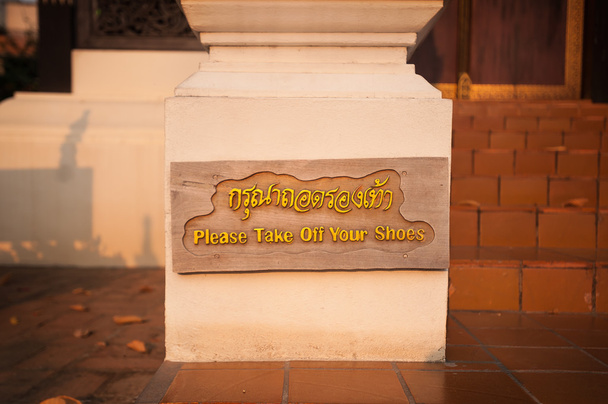 Please Take Off Your Shoes sign at Wat Chedi Luang, Chiang Mai, Thailand - Photo, Image