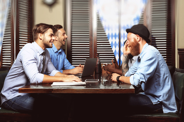 Young men talking in cafe - Фото, зображення