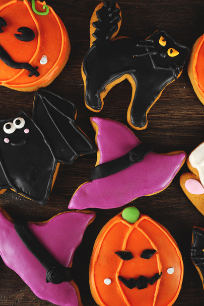 Creative Halloween cookies on wooden background - Фото, зображення