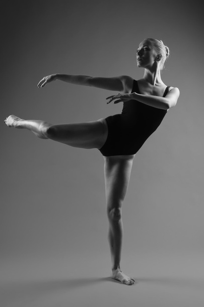 Modern ballet dancer posing on dark background - Fotografie, Obrázek