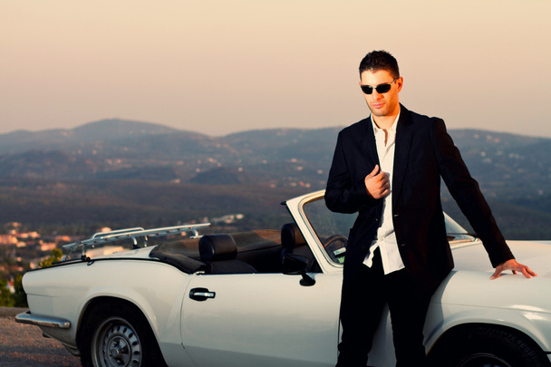 Man with white convertible - Photo, Image