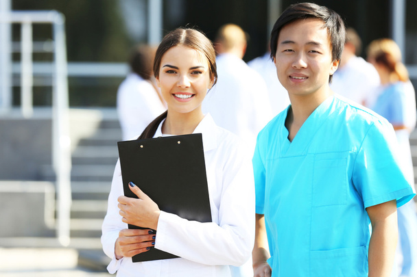 Medical concept - two doctors with stethoscopes and prescription clipboard - Photo, Image