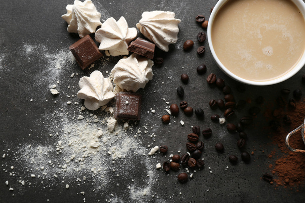 Cup of coffee and sweets on black wooden background - Foto, Imagem