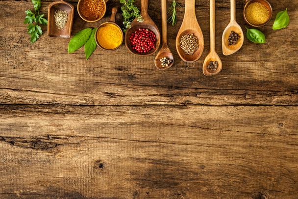 Colorful spices on wooden table - Foto, Imagen