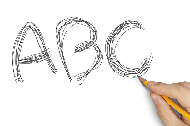 Hand writing ABC with pencil on white sheet - Foto, Imagen