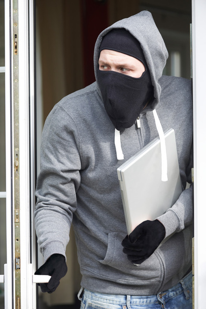 Burglar Breaking Into House And Stealing Laptop Computer - Fotoğraf, Görsel