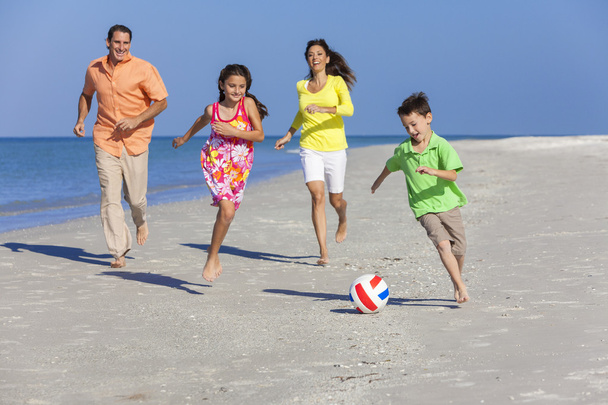 Family Playing Football Soccer on Beach - Foto, immagini