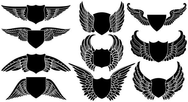 Tarcze ze skrzydłami - Wektor, obraz