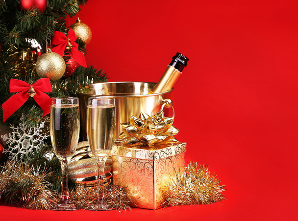 Christmas or New Year's Eve. Champagne and Presents over Red - Foto, imagen