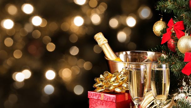 Christmas or New Year's Eve. Champagne and Presents over Black - Photo, Image