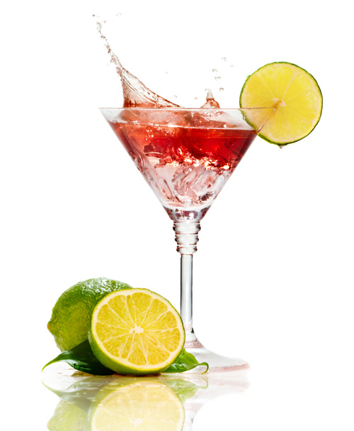 Red martini cocktail with splash and lime isolated - Photo, Image