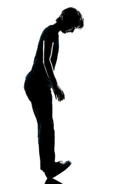 One young teenager boy or gir standing balancing on heels silhou - Fotografie, Obrázek