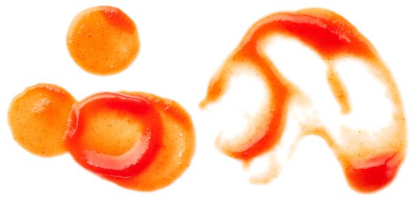 Manchas de ketchup sobre fondo blanco
 - Foto, Imagen