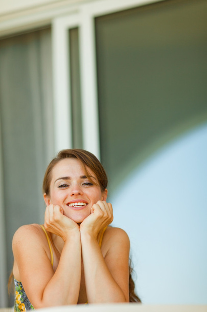Portrait of young female sitting on terrace - Фото, зображення