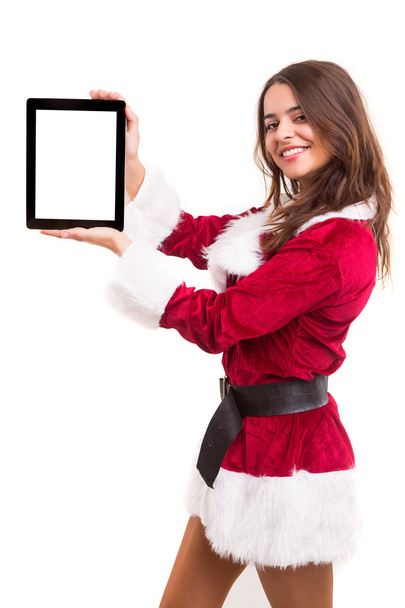 Woman in Christmas costume presenting product - 写真・画像