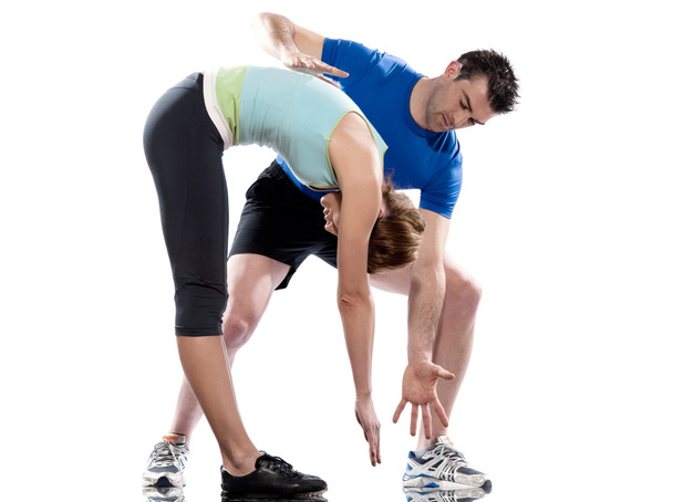 Man aerobic trainer positioning woman Workout - Foto, Imagen