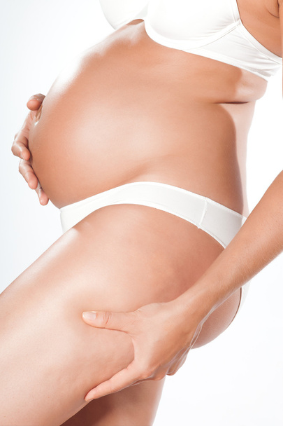 Pregnant woman pinching cellulite - Fotoğraf, Görsel