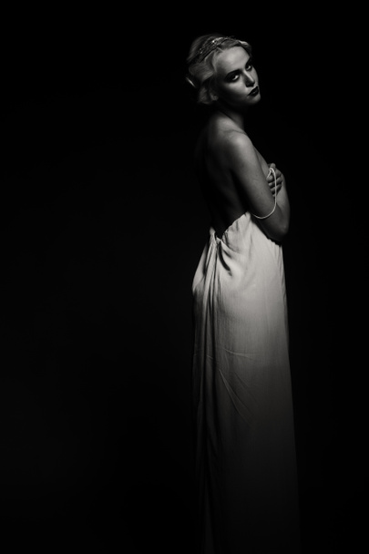 Beautiful blonde in vintage dress on a dark background - Valokuva, kuva