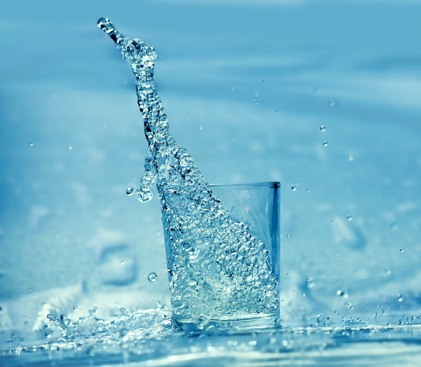 Splashing water from glass - Fotó, kép