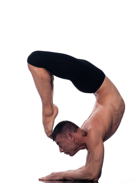 Man yoga scorpion Vrschikasana Pose - Zdjęcie, obraz