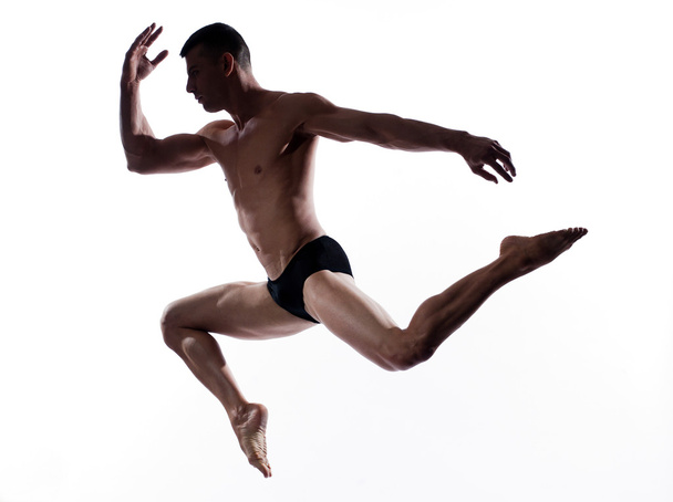 Man dancer gymnastic jump - Фото, изображение