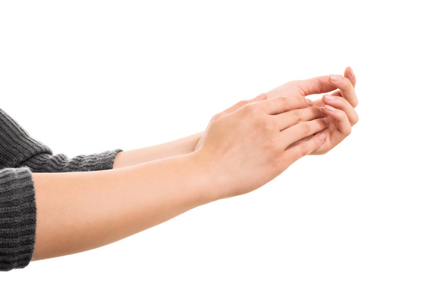 Γυναικεία χέρια χειροκροτούν σε λευκό φόντο - Φωτογραφία, εικόνα