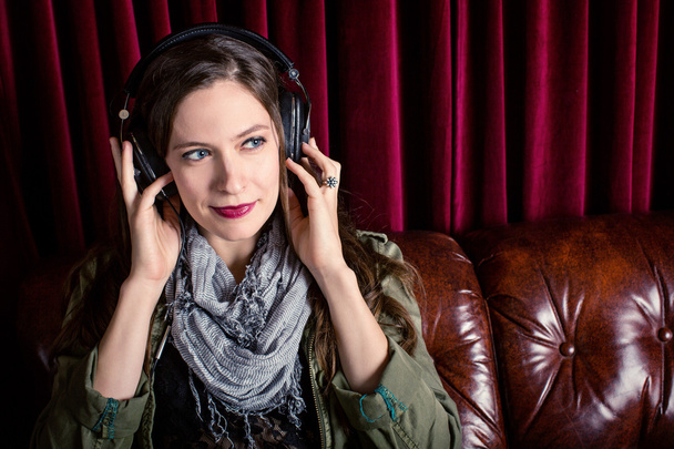 Woman listening to headphones - Photo, Image