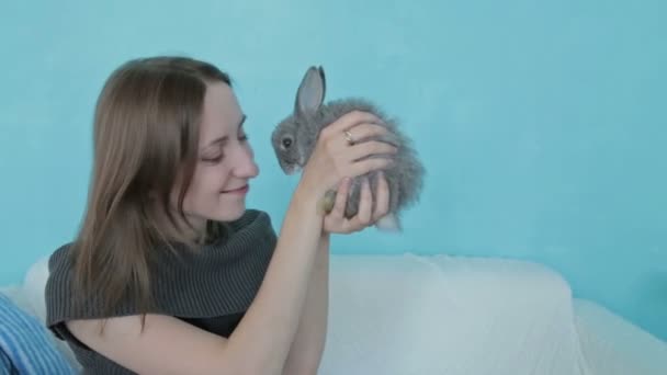 Woman holding little cute rabbit - Footage, Video