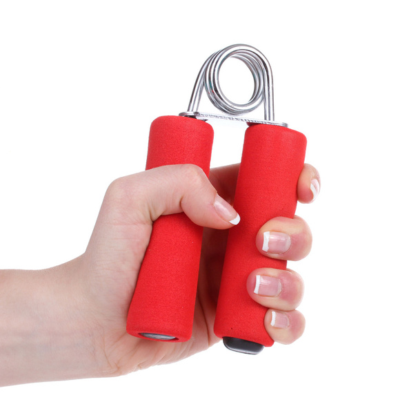 Red hand trainer in hand isolated on white - Foto, imagen