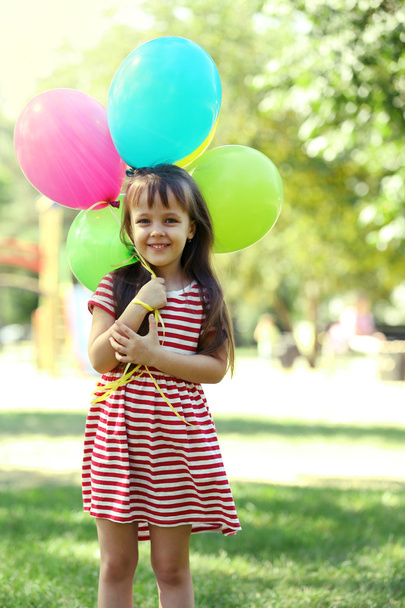 Little girl with balloons  - Foto, imagen