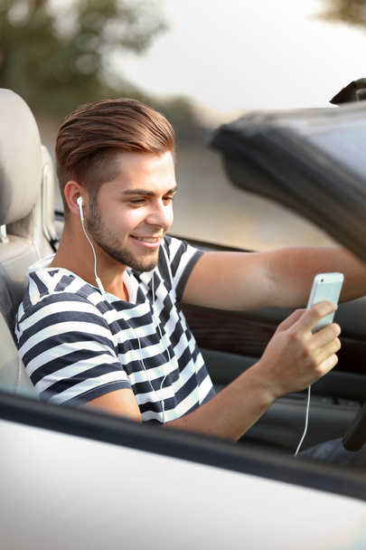 Man with headphones in car - Foto, Imagem
