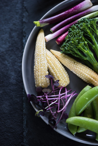 Fresh vibrant vegetables on plate - Foto, afbeelding