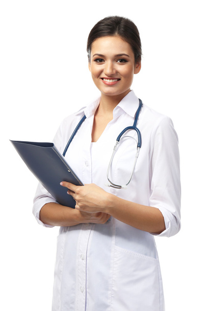 Smiling medical doctor holding a folder isolated on white - Foto, immagini