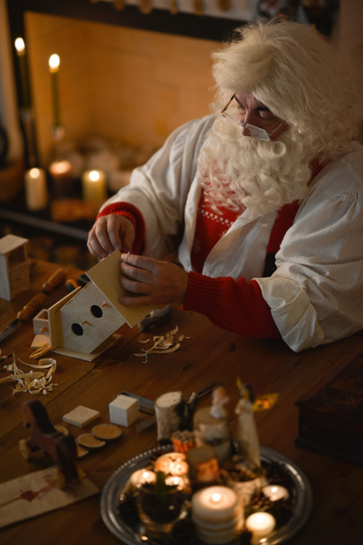 Santa Claus making wooden toys - Valokuva, kuva