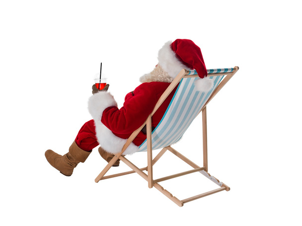 Santa Claus sitting on deck chair - Foto, immagini