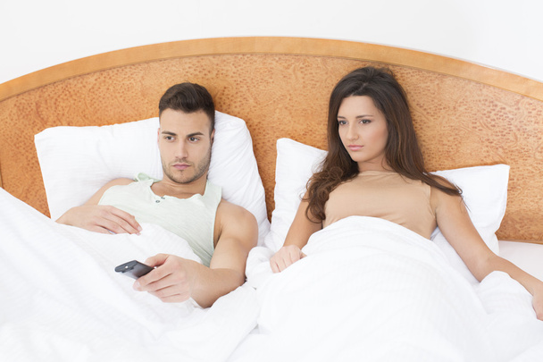 Couple watching TV in bed - Photo, Image