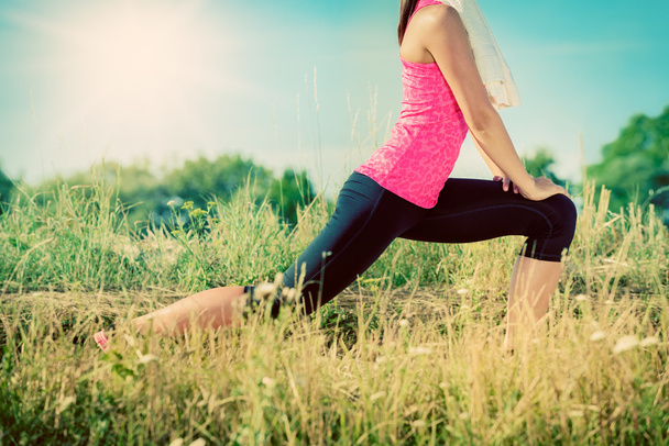 Attractive female stretching before jogging - Fotografie, Obrázek