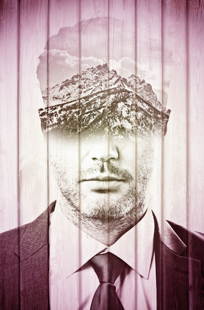 Double explosure with businessman face and mountains with the sk - Foto, imagen
