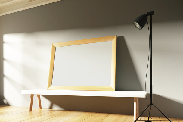 Blank wooden picture frame in a sunny gallery with benches and l - 写真・画像