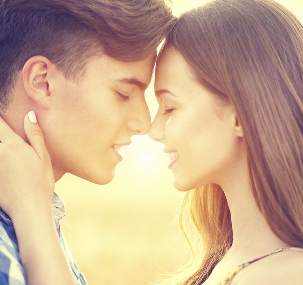 Happy couple kissing  outdoors - Valokuva, kuva