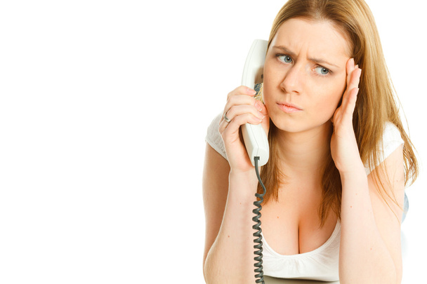 attractive young woman angry talking at telephone - Foto, afbeelding
