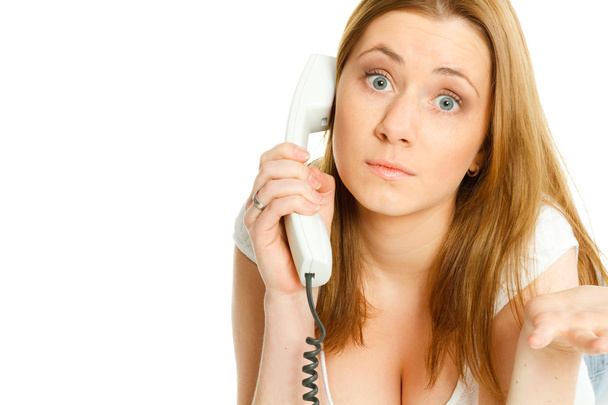 attractive young woman angry talking at telephone - Foto, Bild