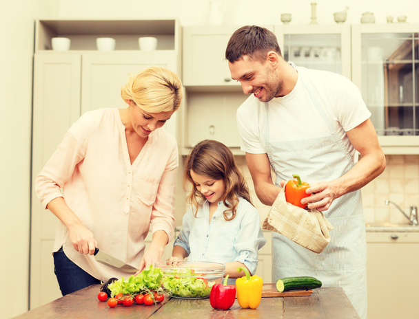 happy family making dinner in kitchen - Foto, Bild