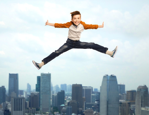 happy smiling boy jumping in air - Fotoğraf, Görsel
