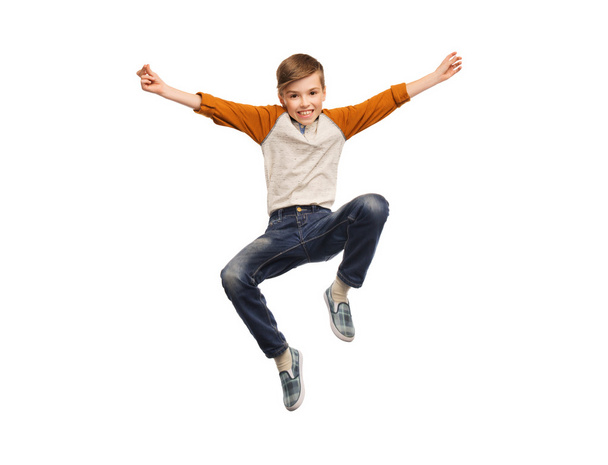 happy smiling boy jumping in air - Фото, зображення